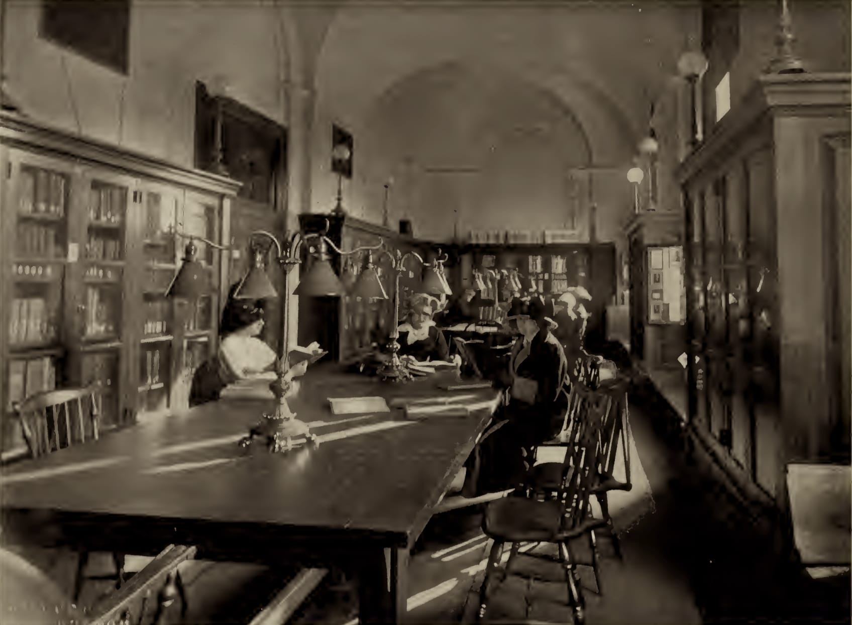 1913 image of the New England Conservatory library (photograph from the Wikimedia Commons category New England Conservatory)